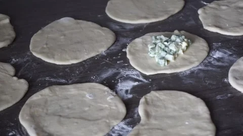 Process of making pies with egg and onion Stock Footage 166558130