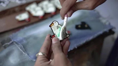 The process of making pin crafts made of acrylic and colored using enamel paint Stock Footage 233228147