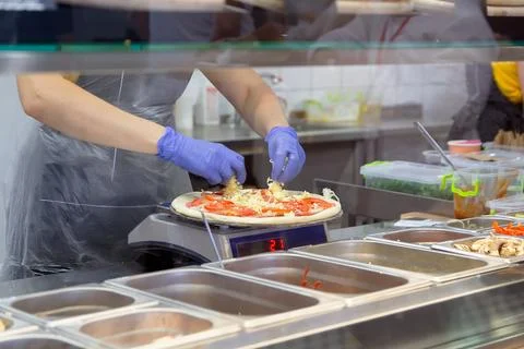 Process of making pizza in the bakery Stock Photos