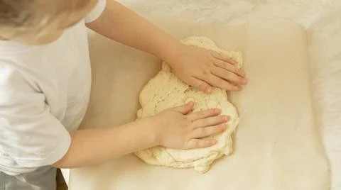 The process of making pizza dough by a child Stock Photos
