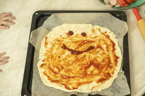 The process of making pizza dough by a child Stock Photos