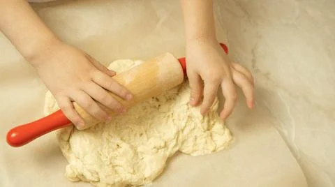The process of making pizza dough by a child Stock Photos