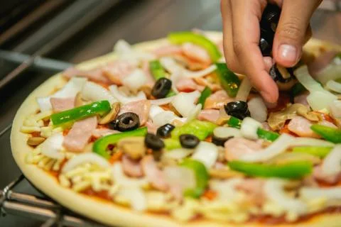 The process of making pizza in the restaurant. Stock Photos