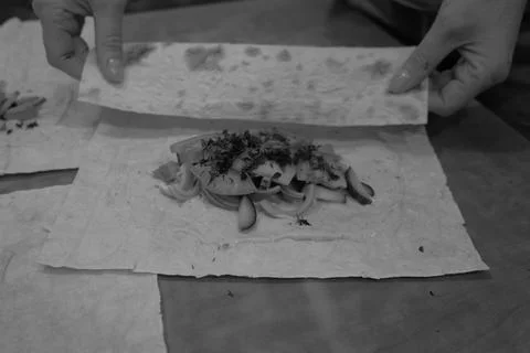 The process of making pizza is visible the product of the human hand Stock Photos