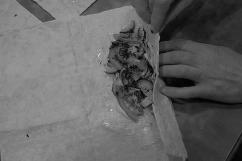 The process of making pizza is visible the product of the human hand Stock Photos