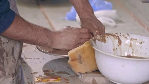 Process of making pottery. Raising vase on pottery wheel. 4 K Stock Footage 84171528