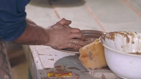 Process of making pottery. Shot on Ursa Mini Pro Camera in 4K UHD. Video stock 84179767