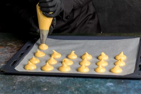 The process of making profiteroles using a cooking bag 스톡 사진