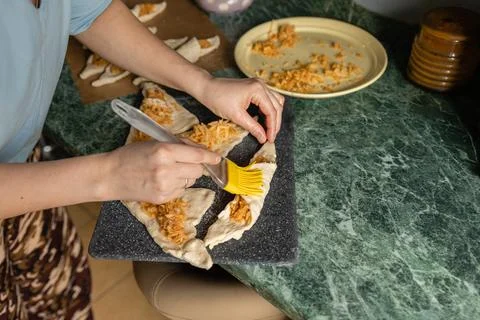 The process of making puff pastry pie. The first culinary experience. Anoint  Stock Photos