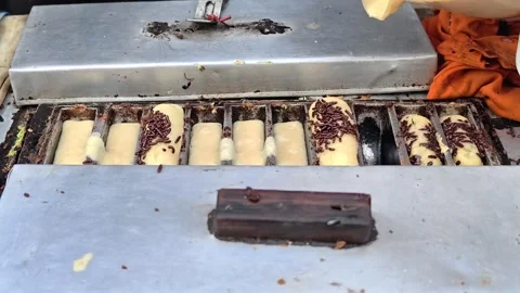 The process of making pukis cake or pancong cake, a traditional cake 動画素材 339274912