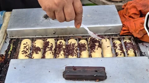 The process of making pukis cake or pancong cake, a traditional cake Stock Footage 339274962