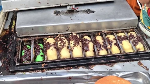 The process of making pukis cake or pancong cake, a traditional cake Stock Footage 339275022