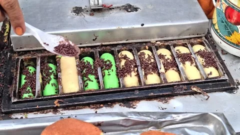 The process of making pukis cake or pancong cake, a traditional cake Stock Footage 339275046