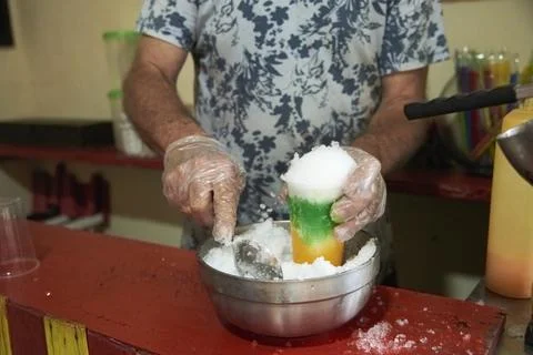 Process of making a raspado, a sweet refreshing Colombian snack Stock Photos