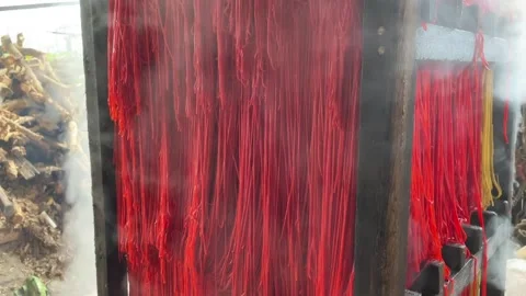 The process of making red noodles, a traditional Indonesian food Stock Footage 291279098