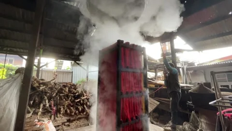 The process of making red noodles, a traditional Indonesian food Stock Footage 291279118