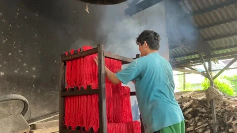 The process of making red noodles, a traditional Indonesian food Stock Footage 291279128