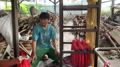 The process of making red noodles, a traditional Indonesian food Stock Footage 291279480