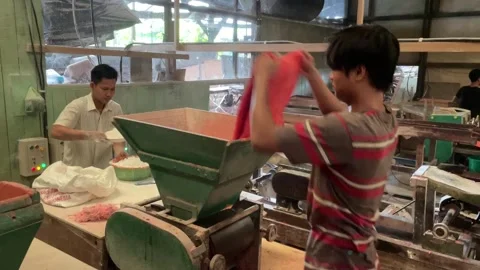 The process of making red noodles, a traditional Indonesian food Stock Footage 291279522