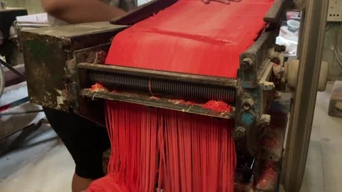The process of making red noodles, a traditional Indonesian food Stock Footage 291279576