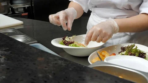 The process of making salads in a restaurant. Fresh Vegetable and Seafood Sal Stock Footage 119361141