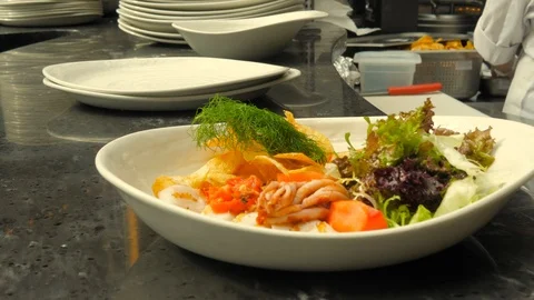 The process of making salads in a restaurant. Fresh Vegetable and Seafood Sal Stock Footage 119361200