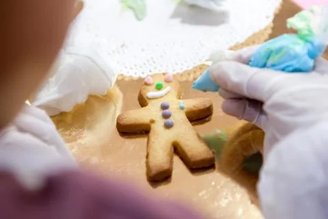 The process of making Sandman the cookies manually apply the glaze of your Stock Photos