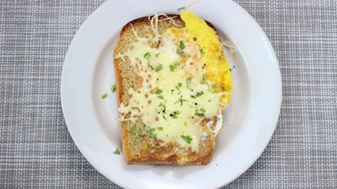 The process of making a sandwich with fried egg and cheese. Recipe. Stock Footage 151482557