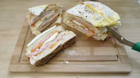 The process of making a sandwich with ham, cheese and egg Stock Footage 150772491