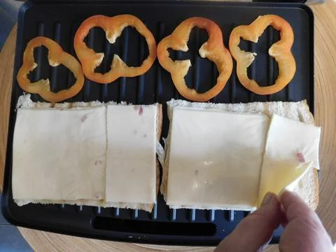 The process of making a sandwich with ham, cheese and egg Stock Photos