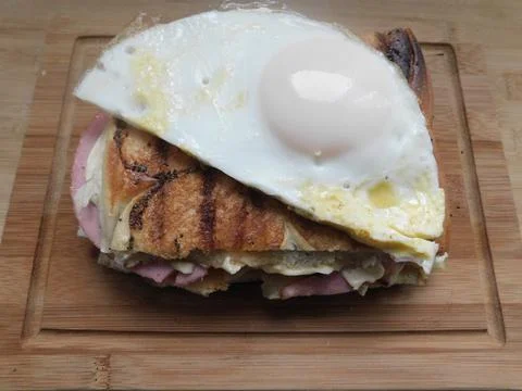 The process of making a sandwich with ham, cheese and egg Stock Photos