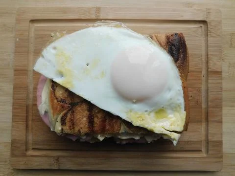 The process of making a sandwich with ham, cheese and egg Stock Photos