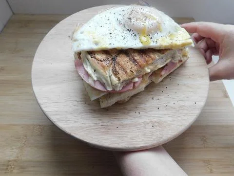 The process of making a sandwich with ham, cheese and egg Stock Photos