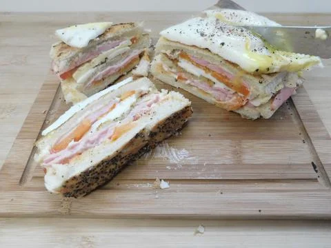 The process of making a sandwich with ham, cheese and egg Stock Photos
