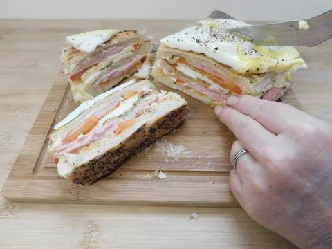 The process of making a sandwich with ham, cheese and egg Stock Photos