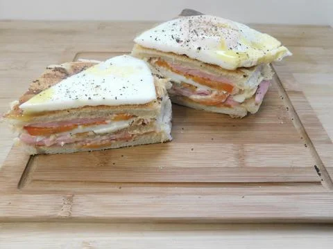 The process of making a sandwich with ham, cheese and egg Stock Photos