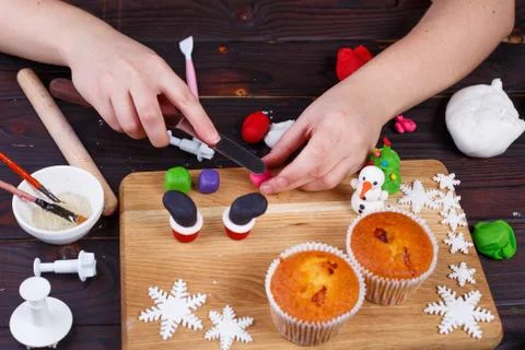Process of making Santa's boots cupcake decoration of confection Stock Photos