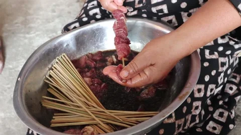 Process of making satay, a traditional Indonesian cuisine dish Stock Footage 210799752