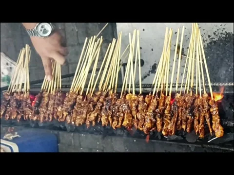 The process of making satay, a very popular street food Stock Footage 289162998