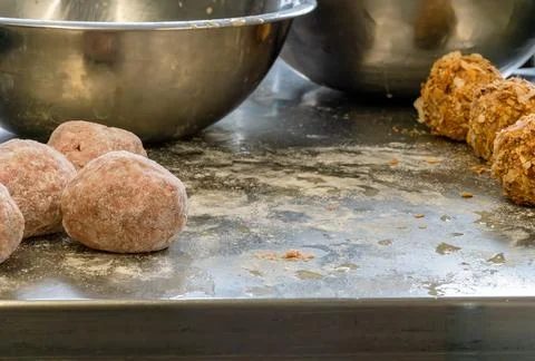 Process of making scotch eggs, dirty metal table from egg wash and flour. Stock Photos