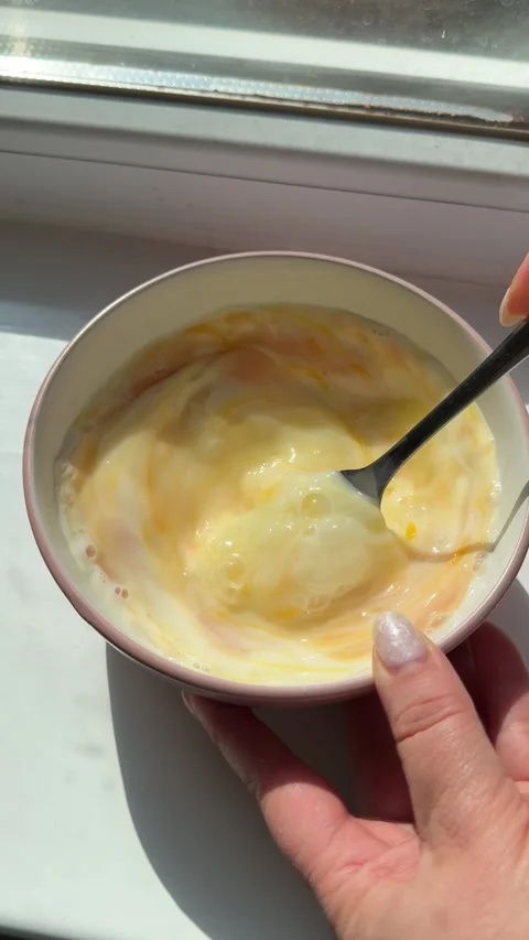 Process of making a scrambled egg omelet Woman preparing homemade omelette Stock Footage 317267552