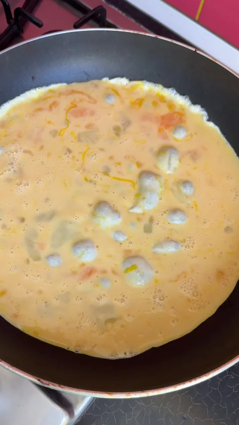 Process of making a scrambled egg omelet Woman preparing homemade omelette Stock Footage 317267563