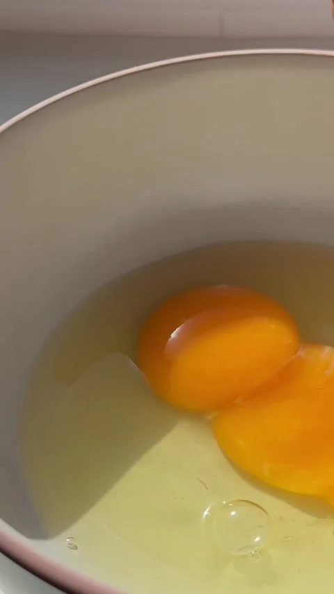 Process of making a scrambled egg omelet Woman preparing homemade omelette Stock Footage 323717582
