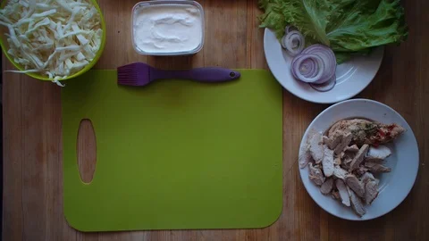 The process of making shawarma with female hands on a wooden table, top view. Stock Footage 104725553