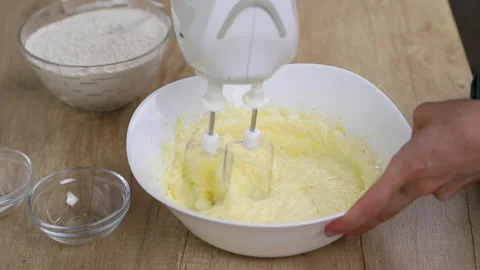 The process of making shortbread dough, beating eggs with butter Stock Footage 316631579