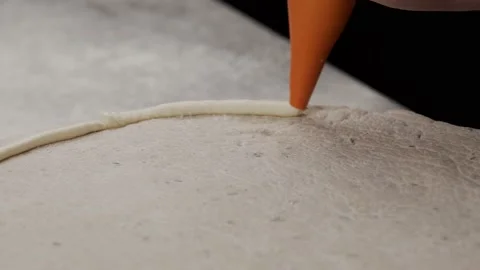 The process of making stuffed crust pizza dough with cheese on kitchen table 4K Stock Footage 153086172