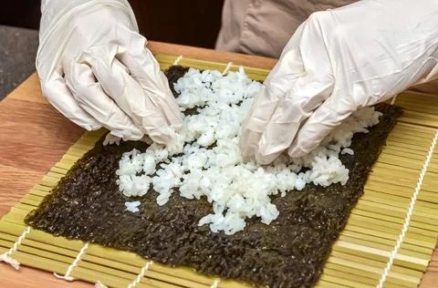 The process of making sushi and rolls, top view,rice for sushi. Stock Photos