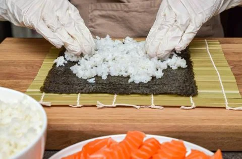 The process of making sushi and rolls, top view,rice for sushi. Stock Photos