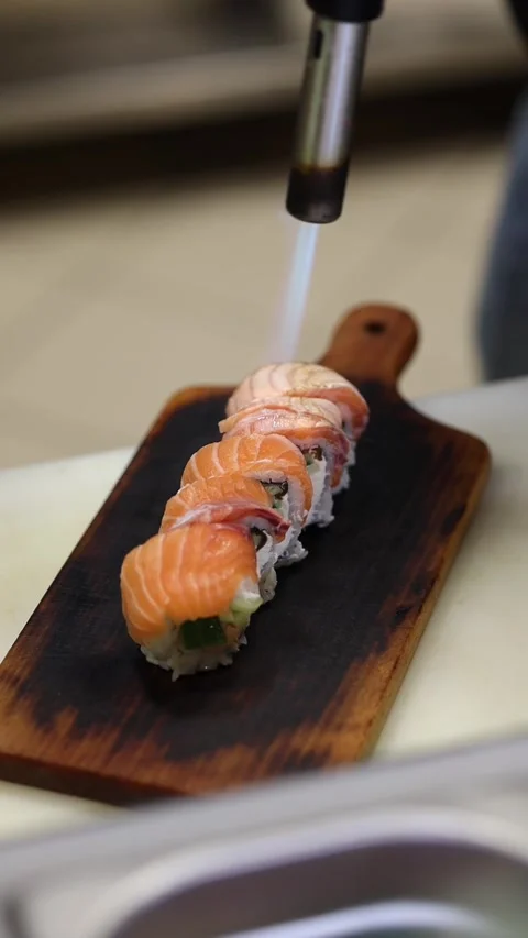 The process of making sushi rolls in a professional restaurant kitchen Stock Footage 331872240