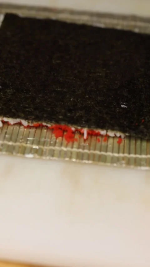 The process of making sushi rolls in a professional restaurant kitchen Video stock 332490327
